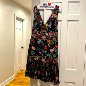Tadashi Shoji multi colored floral dress, size 16. Zip back closure, pleated hem
